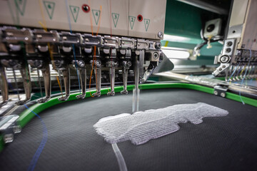 Embroidery student school name tag in Textile Industry at Garment Manufacturers Kota Kinabalu, Sabah, Malaysia.(selective focus and soft focus)