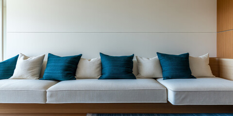 Comfortable modern seating area with blue and white cushions in a bright indoor space
