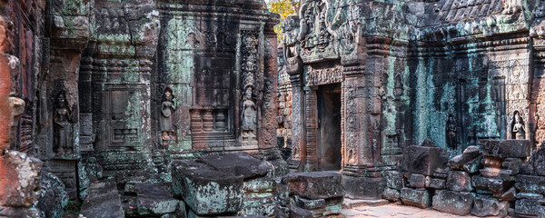Naklejka premium Preah Khan temple interior in Cambodia, rock entrance corridor.