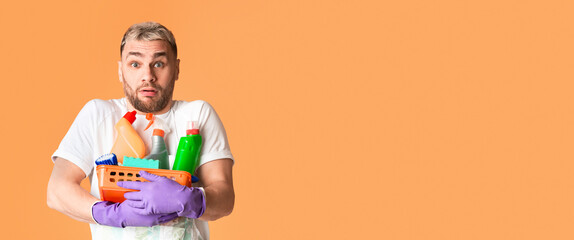 Cleanliness at home concept. Funny man with basket of cleaning supplies