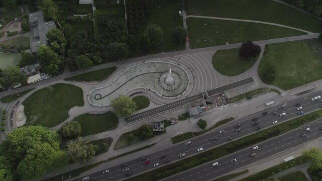 Fountain park next to road 4k drone footage Dlog 10 Bit ungraded
