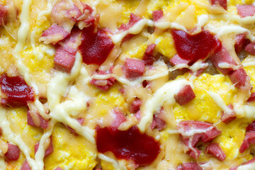 Close-up surface of pizza with cheese. Pizza with cheese and sausage.