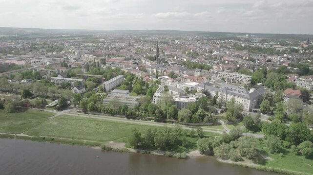 Church above town with river in front 4k drone footage Dlog 10 Bit ungraded