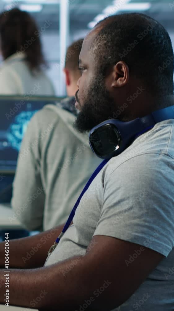Poster portrait of joyful technician working in high tech workplace providing computing resources for diffe