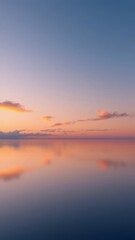 Naklejka premium Tranquil seascape at sunset with colorful sky reflections on calm water