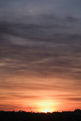 Panoramic sunrise or sunset dusk dawn landscape nature coastal scenery with beautiful fire sky and dramatic cloudscapes over California coast range view near Los Angeles