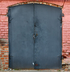 The door is black and has a lock on it