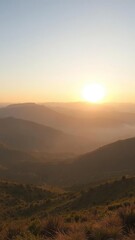 Fototapeta premium Majestic sunrise over the mountains in Serra da Estrela, Portugal with golden light and misty valleys below, valleys, breathtaking