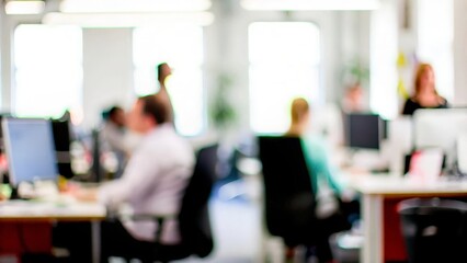 Bright, blurred background of a creative agency workspace.