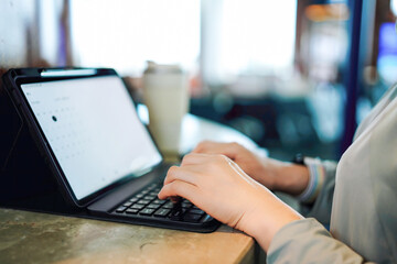 Productive Morning at a Coffee Shop with Laptop