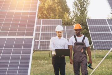 Engineers Working Together at Solar Panel Installation Site