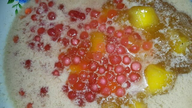 Bubur Ubi is a dessert from Indonesia made of sweet potato, palm sugar and tapioca flour served with coconut milk.