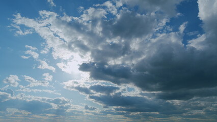 Obraz premium Shining sun rays and eventually breaking through cloud mass. Clouds beautiful sky sunbeams cloud open air. Timelapse.