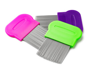 Colorful plastic and metal combs on a white background
