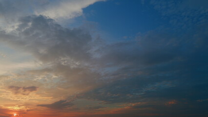 Fototapeta premium High cloud, twilight time. Different shades clouds across darkening blue horizon. Timelapse.