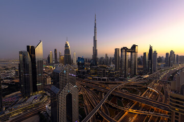 Modern city skyline and cityscape at night in Dubai UAE