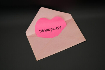 a heart-shaped letter with the words Menopause in a pink envelope