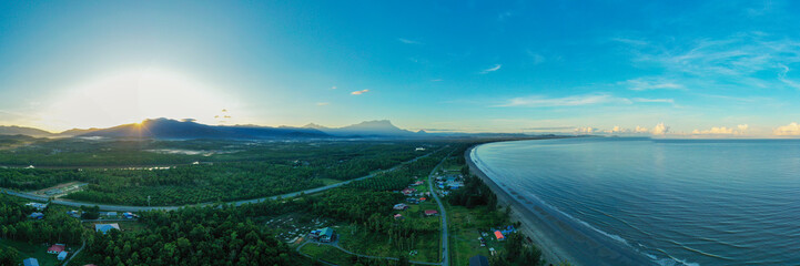 River flowing through tropical rainforest towards mount kinabalu in borneo malaysia