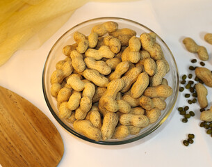 Bowl of Peanuts Snack on Table with White Background