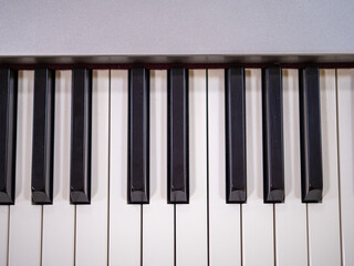 Naklejka premium The piano has a total of 88 keys: 52 white and 36 black. Piano keys (like other keyboard instruments) are arranged in black and white key patterns to make them easier to identify.