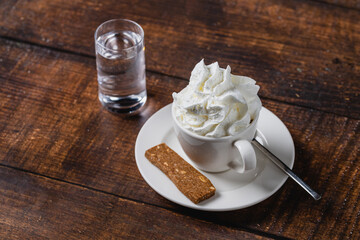 Mocha or white mocha coffee in white porcelain cup on wooden table