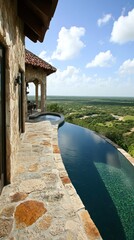 Scenic view from a luxurious infinity pool overlooking a lush landscape.