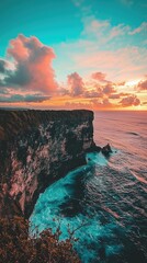 Dramatic Sunset Over Island Cliff and Ocean Waves