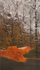Painted by rain, colorful autumn through a rainy wind shield 