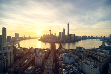 Urban skyline and cityscape at sunrise in Shanghai China.	