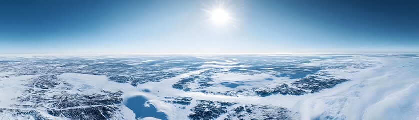Fototapeta premium Aerial View of a Vast, Icy Landscape Under a Bright Blue Sky