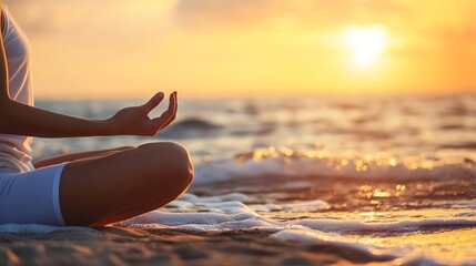 Meditation at sunset by ocean water