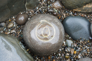 Round rock pebbles, a rock formation close up.