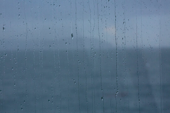 Puget Sound, view through a window with rain drips 