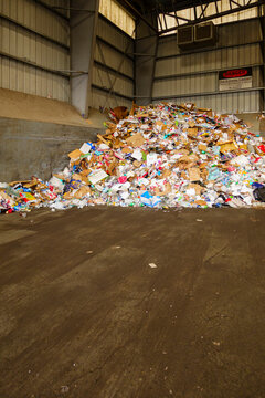 Garbage pile in transfer station, mixed waste in a heap.