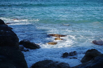 waves crashing on rocks