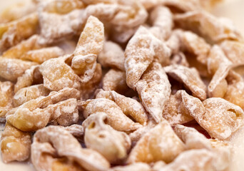 Angel wings (Faworki), cakes. Sweet pastry deep fried and sprinkled with powdered sugar