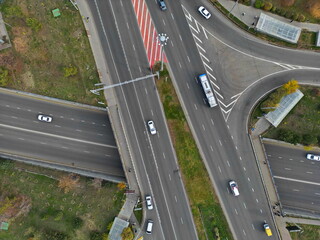 Traffic on one of the main streets. A road junction. The view from the drone.