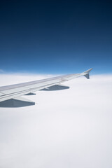 The airplane flew over the clouds.	