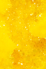 Golden crystal mineral stone. Gems. Mineral crystals in the natural environment. Texture of...