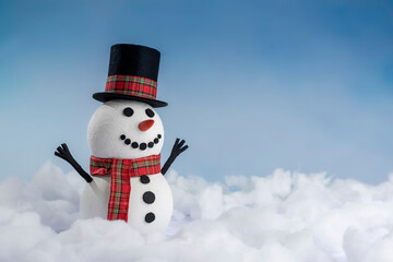 A happy snowman in a top hat and scarf, arms up and ready for winter fun! Set against a snowy background and bright blue sky.