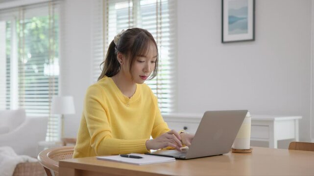 Young adult woman asia people arrange stack undies manage used old bra neat basket box clean house closet shelf eco care. Happy asian smile go green wife home chores zero waste reduce fabric issue.