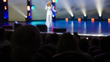 The people enjoying the singer on the stage