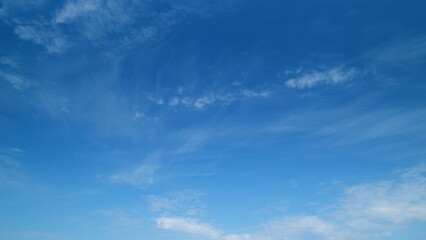 Blue sky with cirrus clouds and sun. Beautiful sky with clouds background. Timelapse.