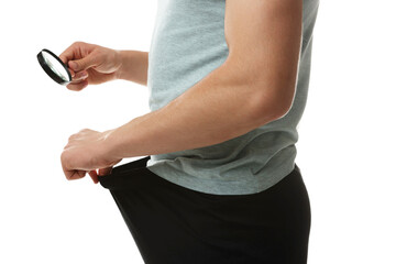 STD (sexually transmitted diseases). Man examining intimate area with magnifying glass on white background, closeup