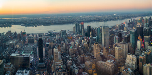 Manhattan skyscrapers high rise buildings in Midtown Manhattan and the East River, aerial view in...