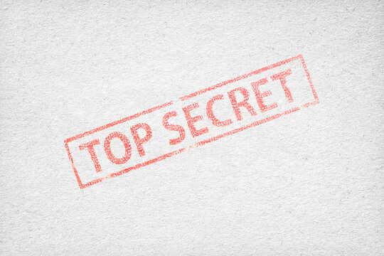 Top secret stamp on the white gray paper background