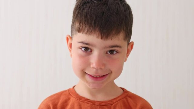 portrait of preschooler boy kid with one missing front teeth is smiling.close up of child showing milk tooth loss.