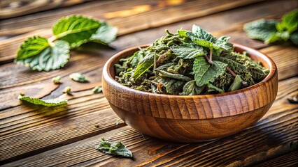 Dried lemon balm tea leaves in a bowl on wooden table , lemon balm, melissa, tea leaves, dried, aromatic, herbal, organic