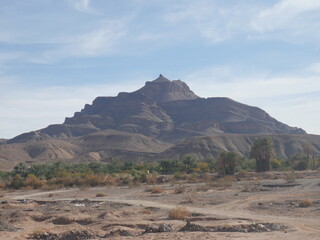 View of the Jbel Kissane mountain in the Moroccan Anti-Atlas, along the Draa valley, where there is the world's largest palm tree grove.