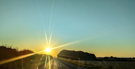 A Stunning Country Road Sunset As The Day And Summer Comes To An End